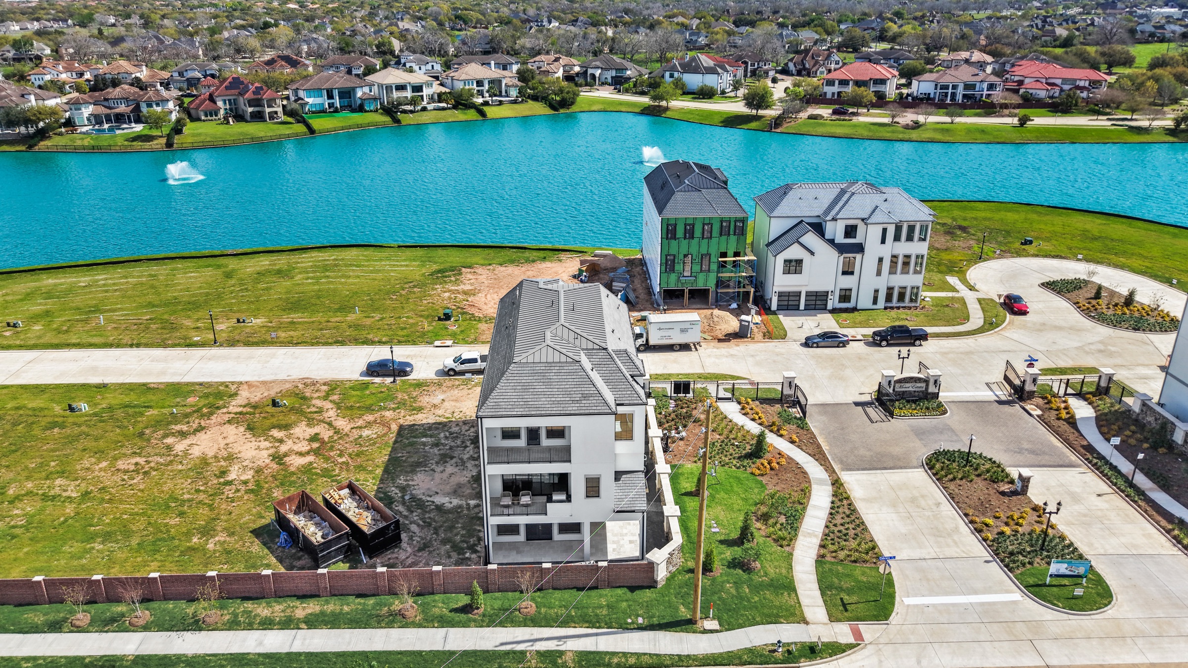 Aerial view of a Psalms residence on the Riverstone lakefront at Monet Estates