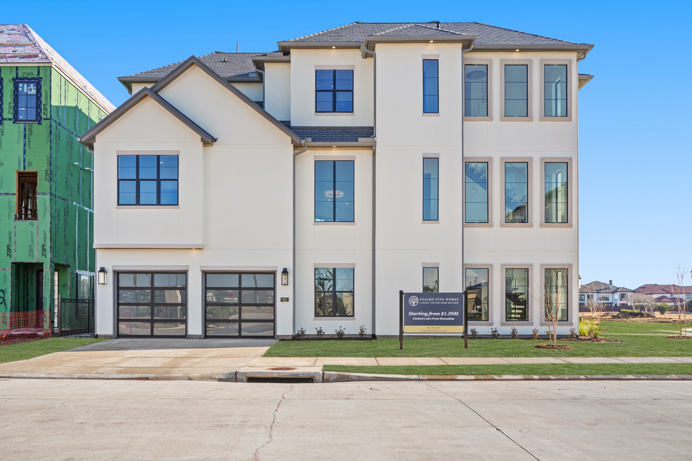 Front exterior of a custom Psalms Fine Homes residence at dusk