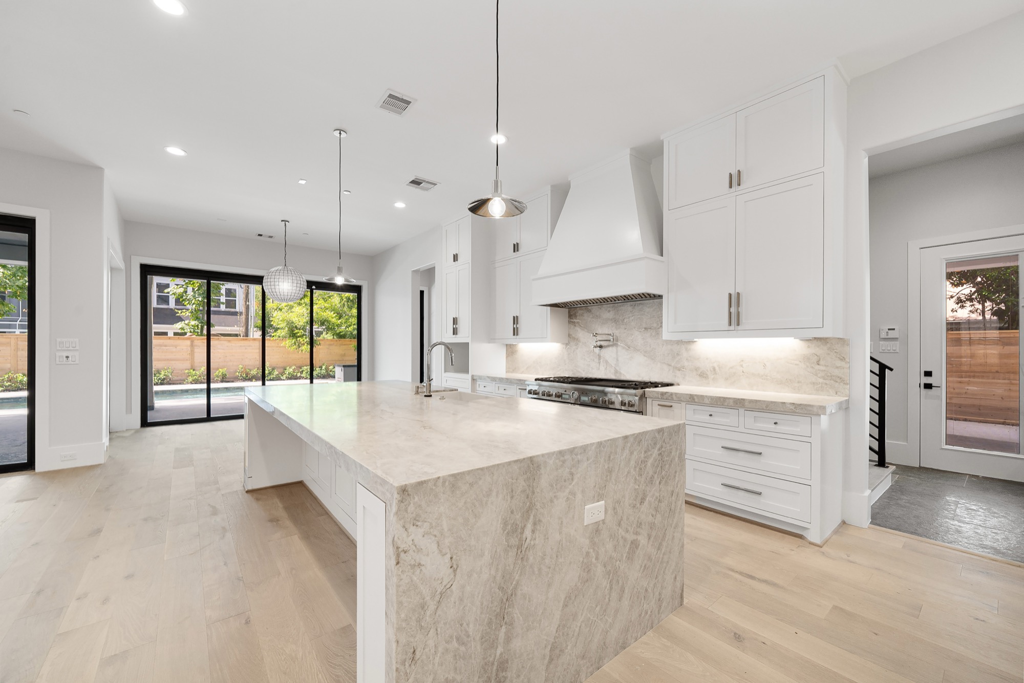 Psalms kitchen showcasing premium finishes, custom cabinetry, stone surfaces, and refined hardware detail