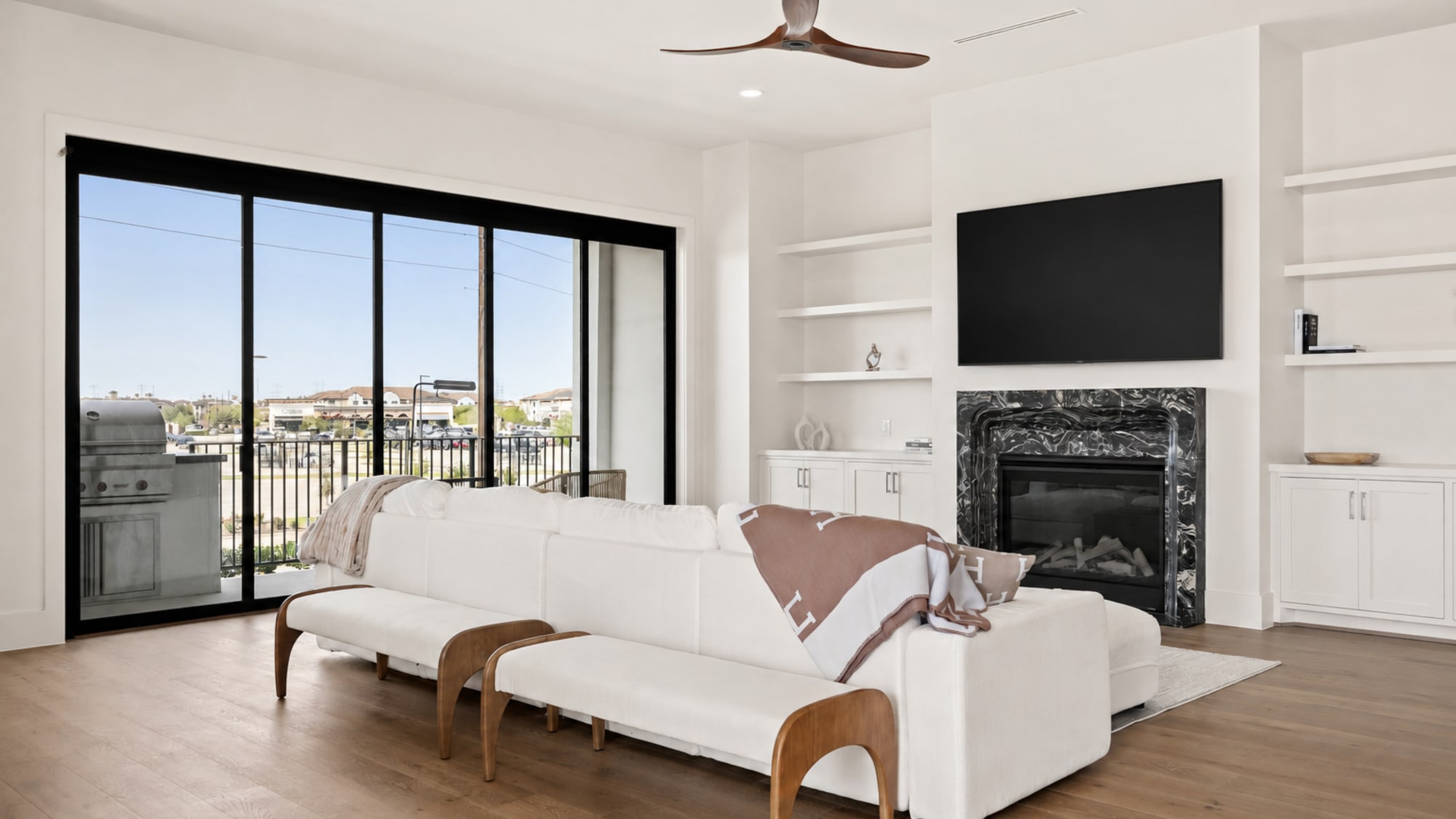 Statement fireplace clad in hand-selected Turkish marble with a sculptural surround