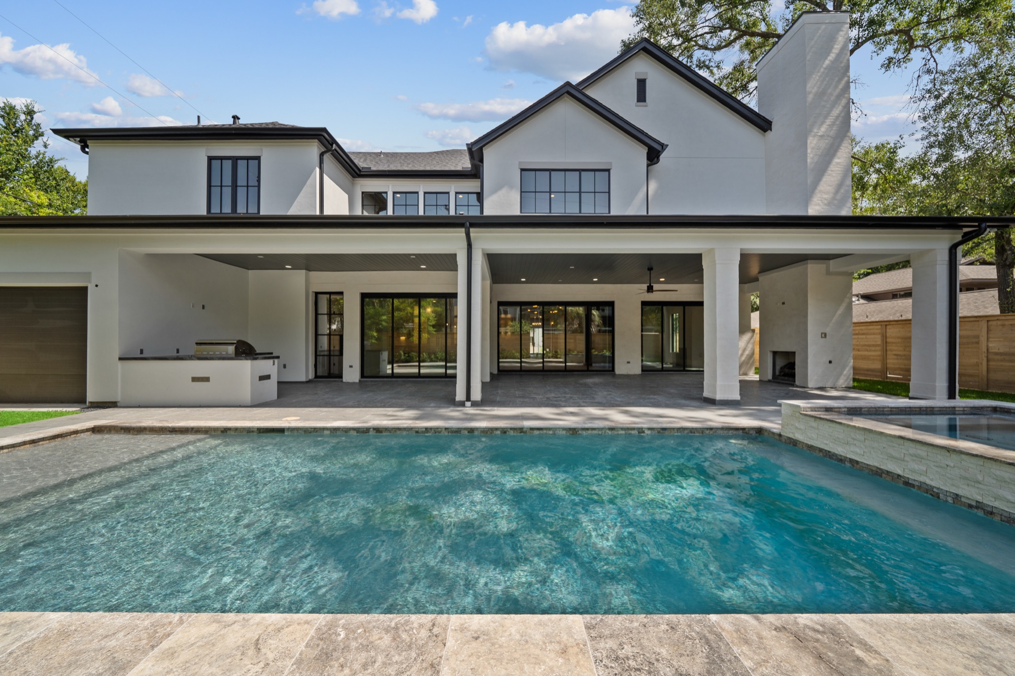Outdoor entertainment space at a custom Psalms Fine Homes residence in Memorial Villages