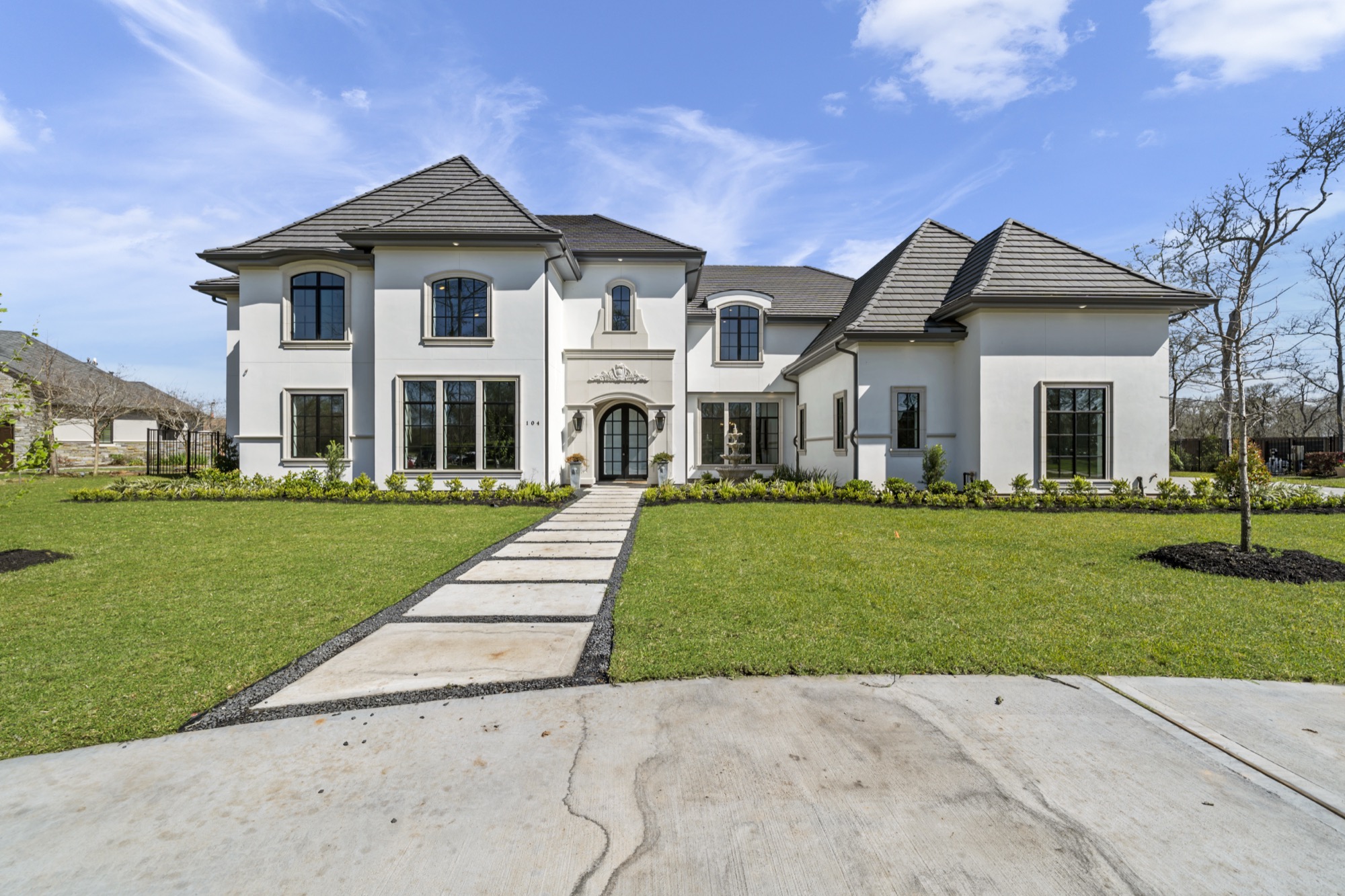 French exterior of a custom Psalms Fine Homes residence in Sienna, Missouri City