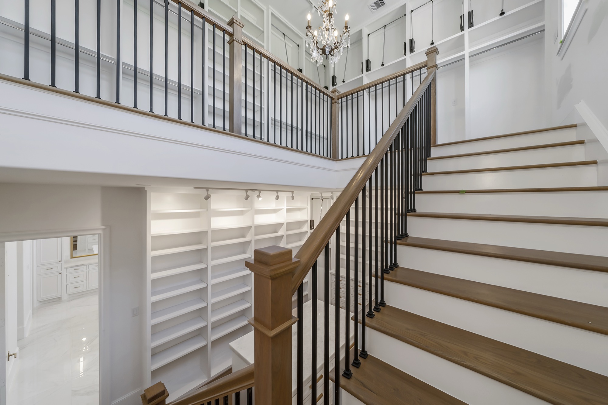Two-story closet in a custom Psalms Fine Homes residence in Sienna