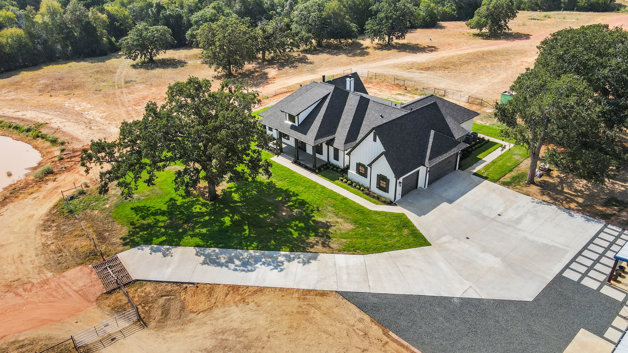 Aerial view of a custom Psalms Fine Homes residence in Smithville, TX