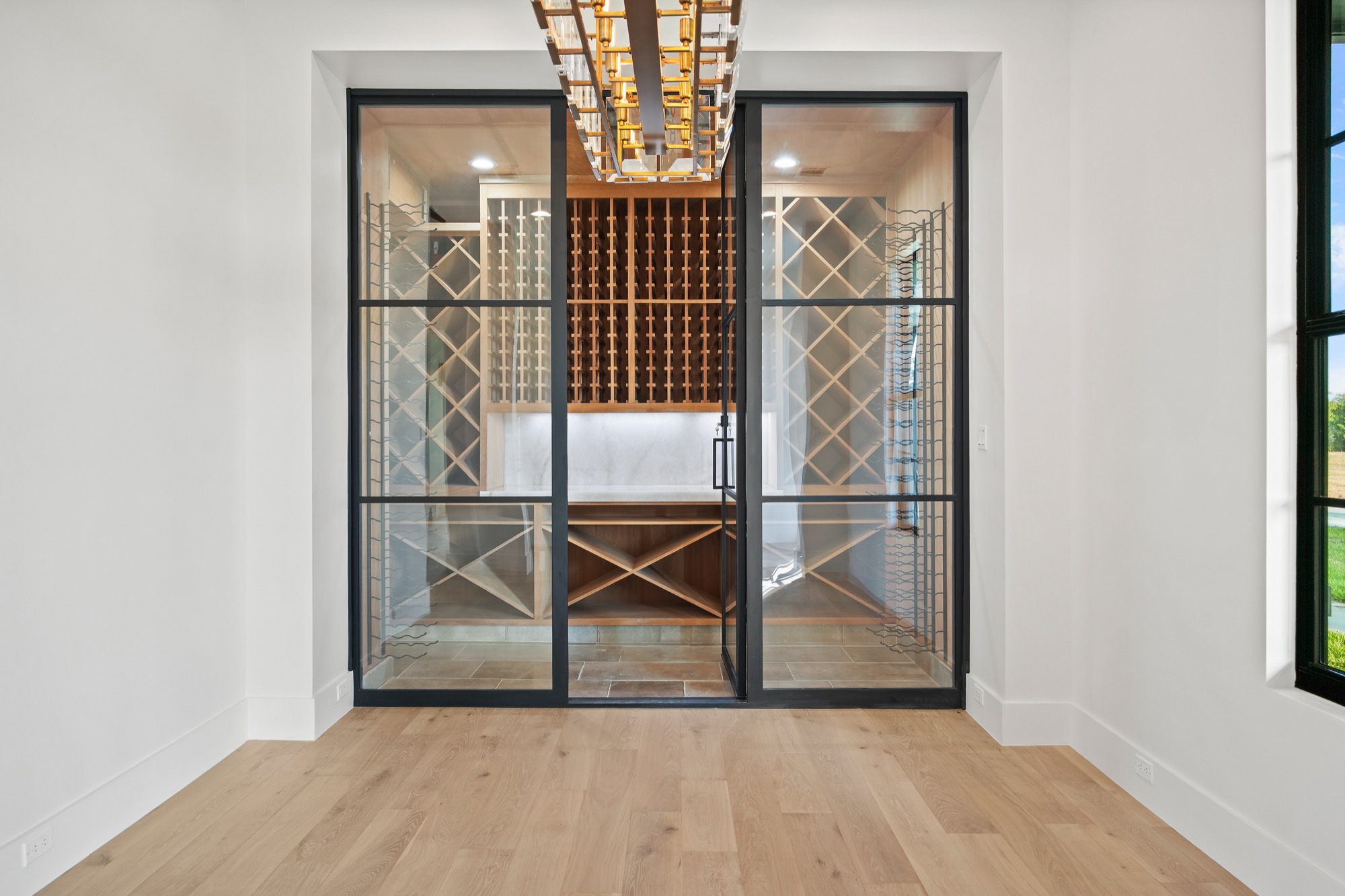 Temperature-controlled wine cellar in a Psalms Fine Homes Smithville residence